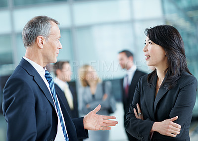 Buy stock photo Meeting, conference and talking with business people in office for networking event, expo and team. Corporate summit, conversation and convention with employees in lobby at seminar for discussion