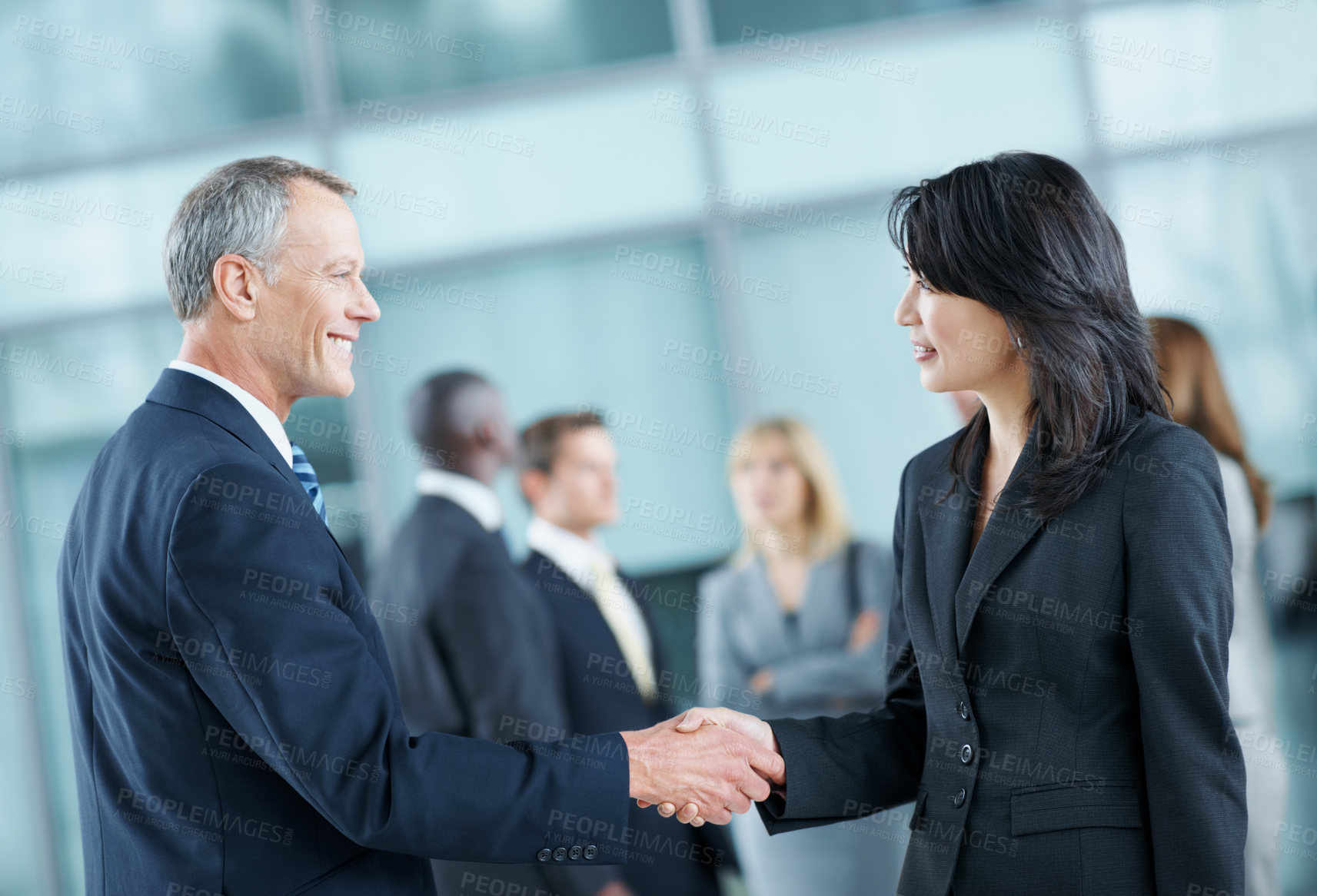 Buy stock photo Business, people and handshake greeting in office for networking, introduction and seminar break. Global event, employees or shaking hands at lobby for collaboration, professional connection or happy