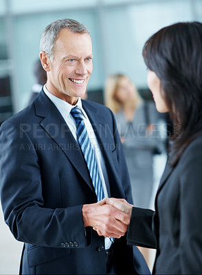 Buy stock photo Meeting, conference and handshake with business man in office for networking event, expo and team. Corporate summit, greeting and convention with employees shaking hands in lobby for welcome