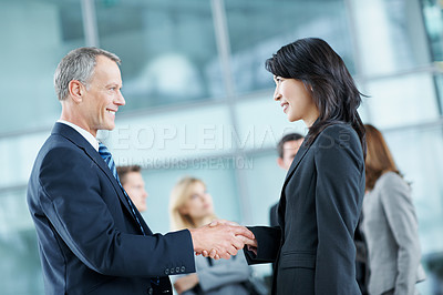Buy stock photo Meeting, conference and handshake with business people in office for networking event, expo and team. Corporate summit, greeting and convention with employees shaking hands in lobby for welcome