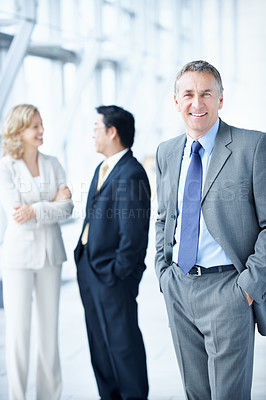 Buy stock photo Portrait, happy and seminar with business man as keynote speaker, broker expo or team. Smile, tradeshow or about us with mature employee at convention center for investor conference and professional