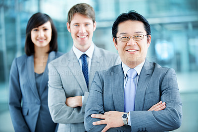 Buy stock photo Corporate, portrait and man with crossed arms, team and financial consultants for insurance company. Office, leadership and business people with manager, about us and happy for finance executives