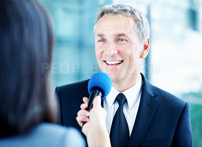 Buy stock photo Interview, smile and question with man and microphone for senator, political campaign and reporter. News broadcast, press conference and government ambassador with mature person for election