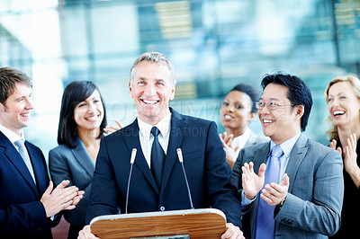 Buy stock photo Smile, podium and applause with business man at conference for keynote guest, success or lecture. Capital venture, investor expo or achievement with people at seminar for pitch and account advisor