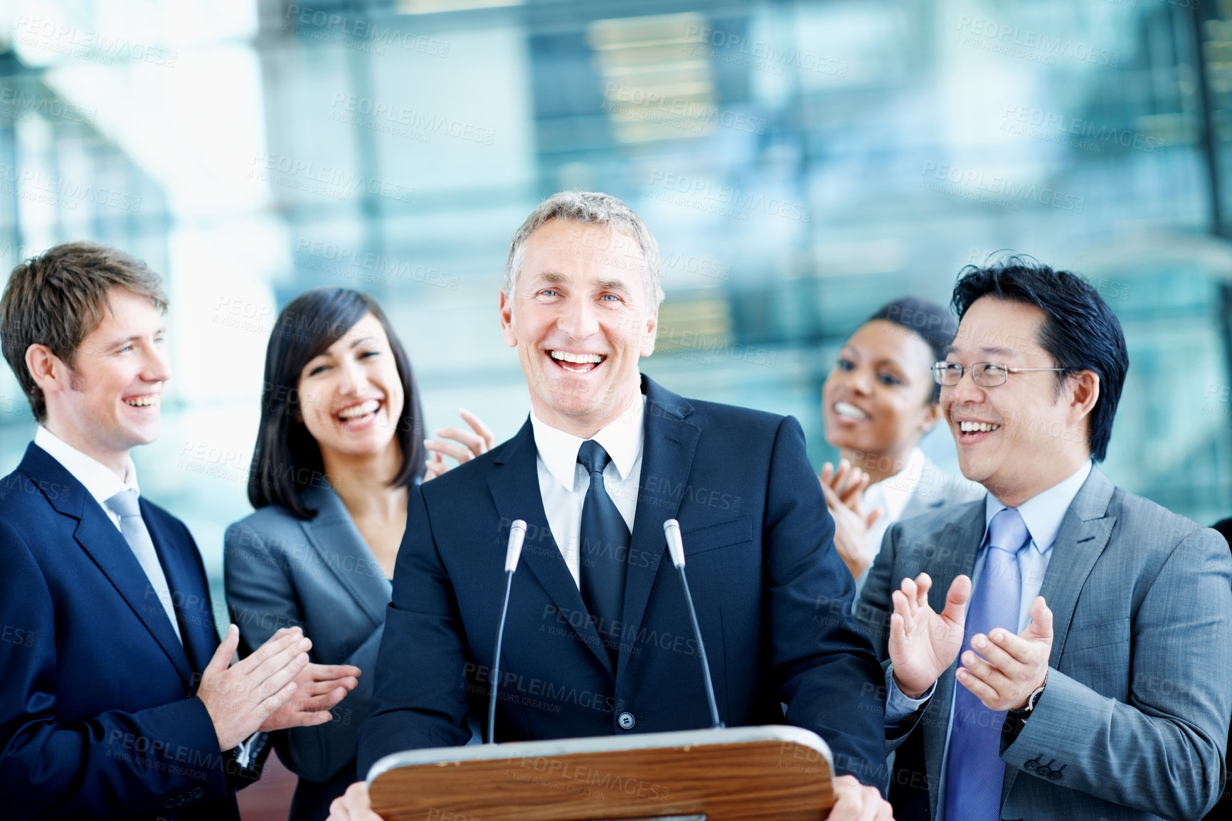 Buy stock photo Portrait, podium and applause with business man at conference for keynote guest, success or lecture. Capital venture, investor expo or achievement with people at seminar for pitch and account advisor