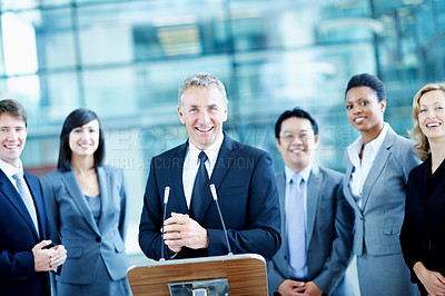 Buy stock photo Speech, podium and portrait with business man at conference for keynote guest, speaker and lecture. Capital venture, investor expo and crowd with people at seminar for pitch and account advisor