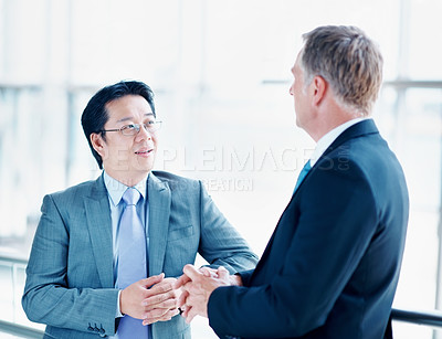 Buy stock photo Mentor, team and talking with business people at conference center for networking, convention and expo. Discussion, workshop and seminar with employees for meeting, corporate and manager feedback