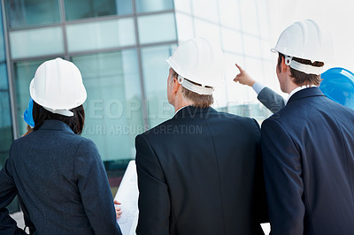 Buy stock photo Blueprint, architect and back of business people in city for urban developer, engineer and team. Construction layout, floor plan and designer with employees for meeting and project management