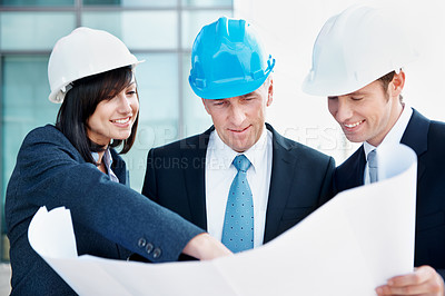 Buy stock photo Blueprint, architect and pointing with business people in city for urban developer, engineer and team. Construction layout, floor plan and designer with employees for meeting and project management