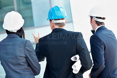 Buy stock photo Architecture, pointing and back of business people with blueprint for engineer, meeting and team. Construction project, building inspection and floor plan with employees for property developer