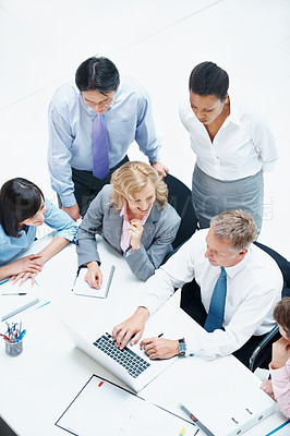 Buy stock photo Above, people and laptop in office for business, finance team and budget overview discussion. Group, collaboration or paperwork with pc for financial plan notes, revenue or expense agenda in meeting