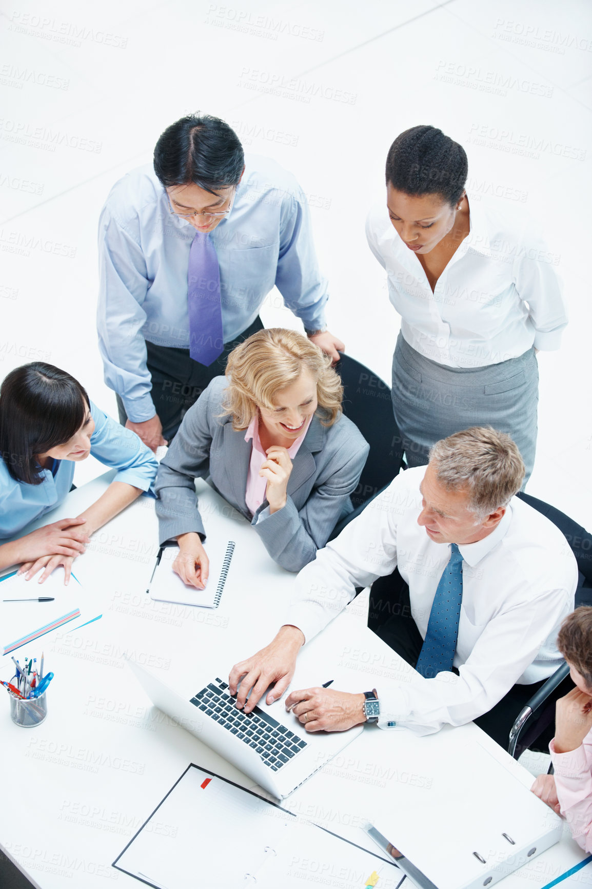 Buy stock photo Above, people and laptop in office for business, finance team and budget overview discussion. Group, collaboration or paperwork with pc for financial plan notes, revenue or expense agenda in meeting