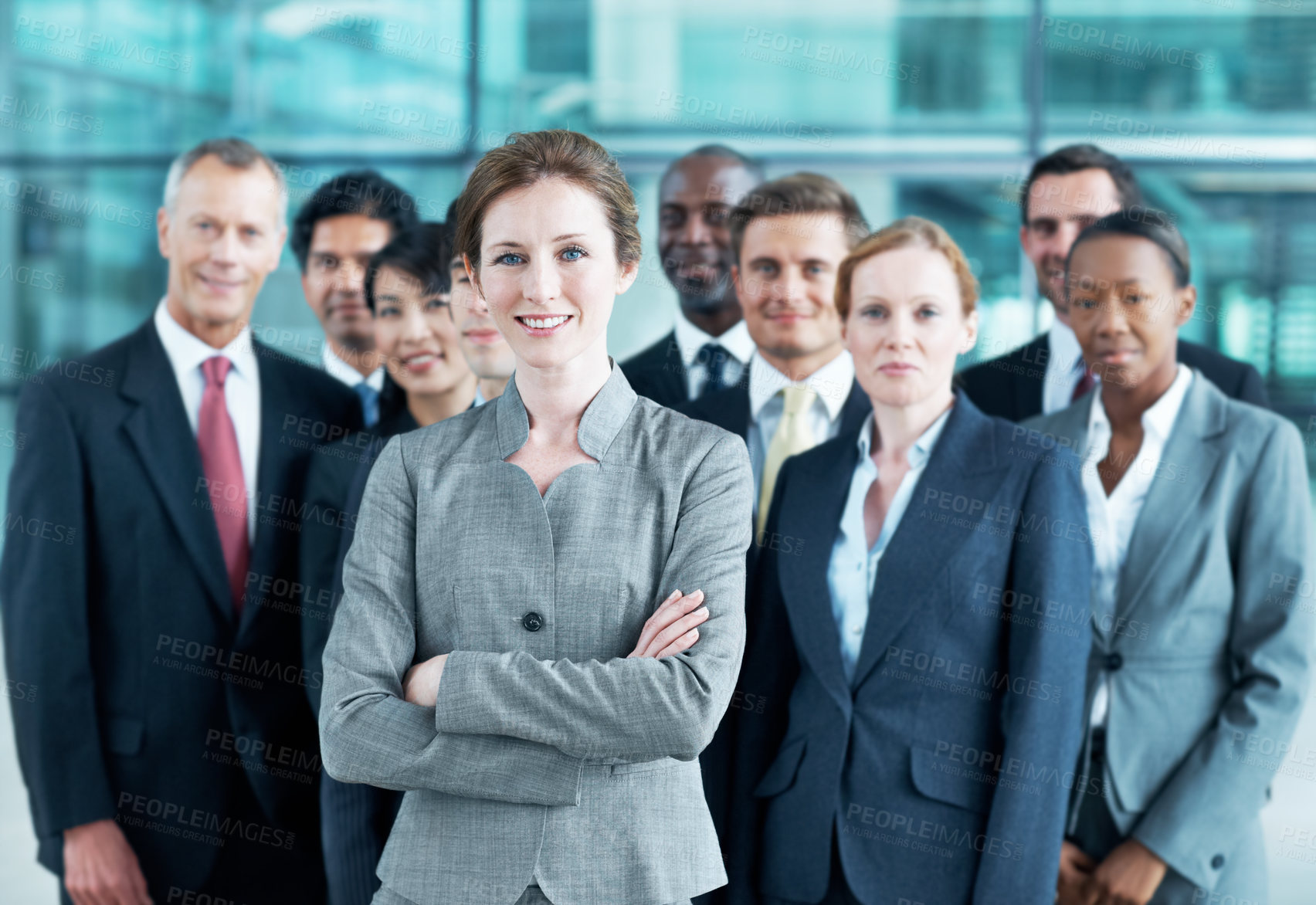 Buy stock photo Portrait, leader and arms crossed with business woman in office for community, solidarity or diversity. Synergy, support and partnership with employees in lobby for career, about us and mission