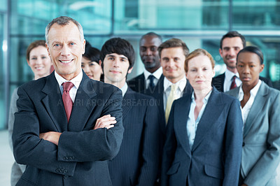 Buy stock photo Portrait, leader and arms crossed with business man in office for community, solidarity or diversity. Synergy, support and partnership with employees in lobby for career, about us and mission