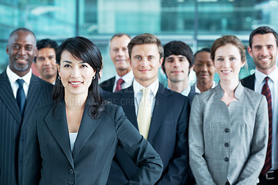 Buy stock photo Portrait, leadership and smile with business woman in office for community, solidarity or diversity. Synergy, support and partnership with employees in lobby for career, about us and mission