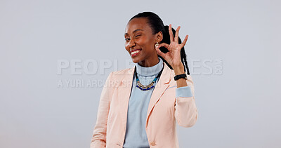 Buy stock photo Hand gesture, portrait and wink with black woman in studio for approval, feedback or review. Perfect, smile and space with happy person on white background for positive result, vote or OK well done