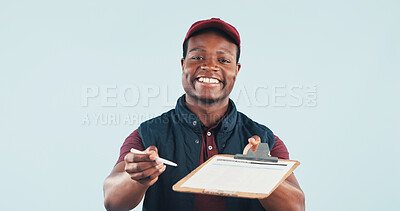 Buy stock photo Portrait, clipboard and delivery man in studio for signature, space or postal service for distribution. Happy, black person or courier with logistics, shipping or paperwork to sign on blue background