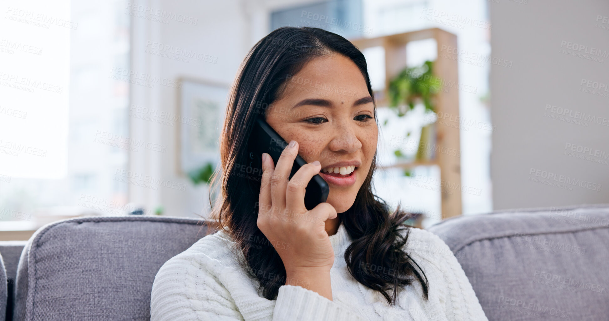 Buy stock photo Phone call, happy and woman on sofa in home with gossip, communication or connectivity in living room. Cellphone, relax and Asian person on mobile conversation for catch up in apartment on weekend.