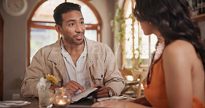 Buy stock photo Talking, happy and couple in restaurant for date, bonding and celebrate anniversary together. Conversation, fine dining and man with woman for romantic dinner, relationship and menu options for order