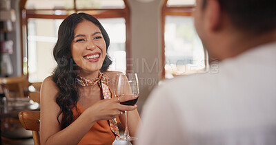 Buy stock photo Couple, laugh and woman with wine in restaurant for date, bonding and anniversary celebration. Happy, fine dining and people with alcohol for romantic dinner, relationship and conversation for love