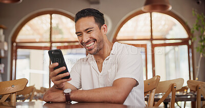 Buy stock photo Laughing, phone and relax with man in restaurant for online review, communication and menu search. Coffee shop rating, funny meme and contact with person and tech for social media, scroll and chat