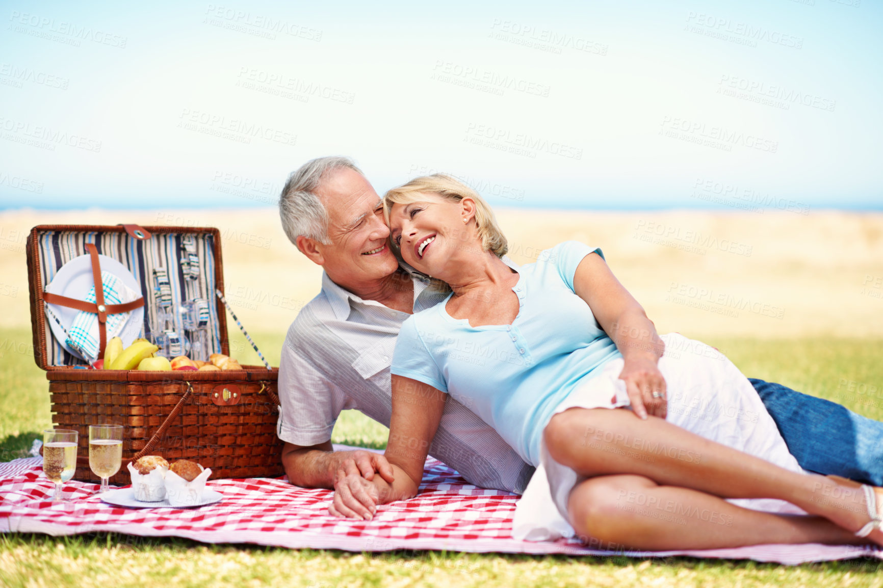 Buy stock photo Love, smile and joke with old couple at picnic for bonding, connection and lunch date. Anniversary, retirement and summer vacation with senior man and woman in nature for relax, laugh and marriage 