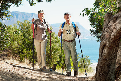Buy stock photo Shot of an adventurous senior couple walking in the forest