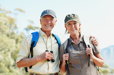 Buy stock photo Portrait of an adventurous senior couple standing outside