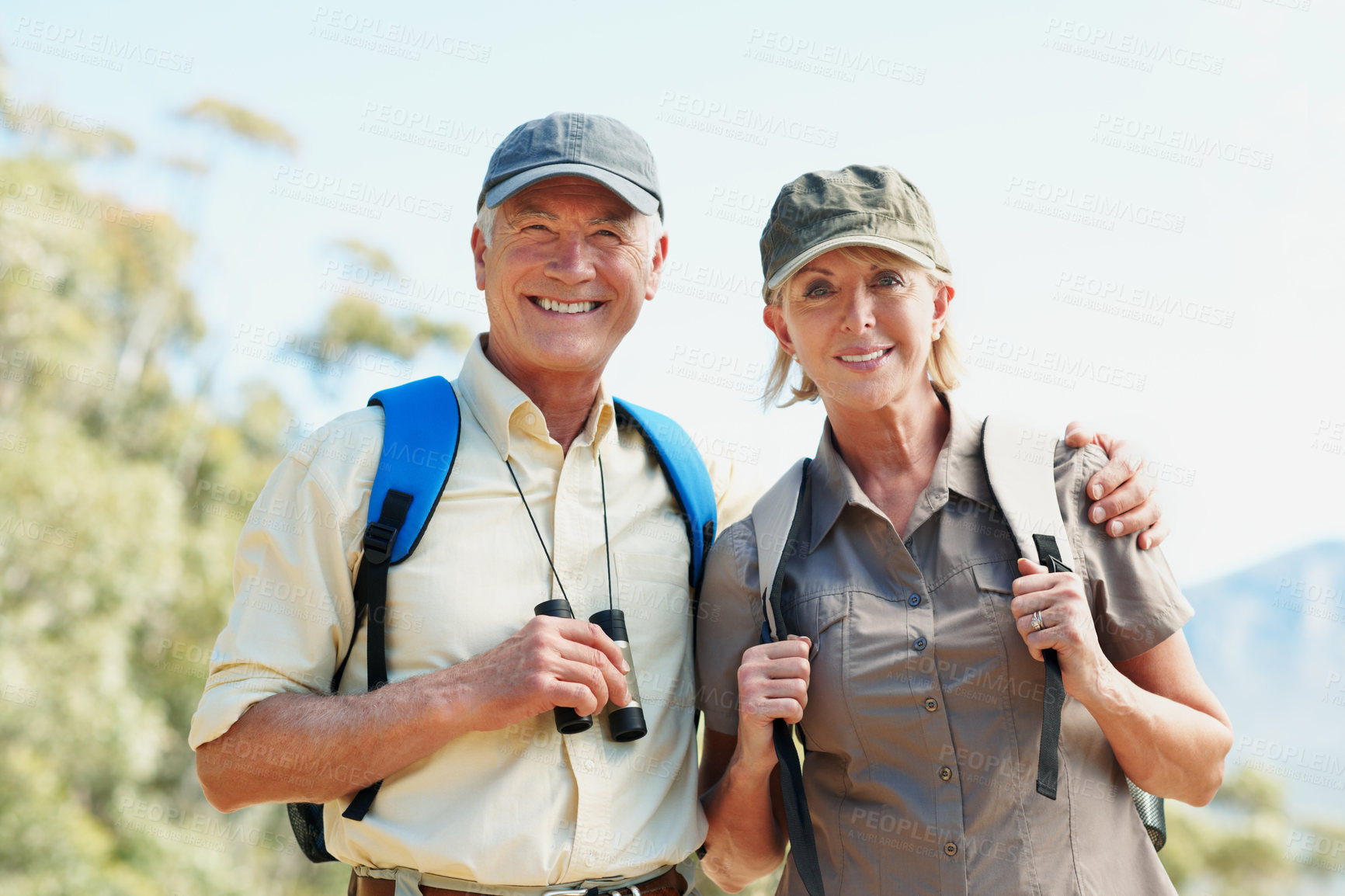 Buy stock photo Binoculars, hiking and portrait with old couple in nature for view, adventure and travel. Birdwatching location, explore and trekking guide with senior man and woman outdoor for retirement vacation
