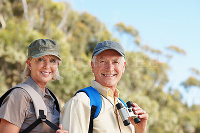 Buy stock photo Portrait of a happy senior couple standing outdoors
