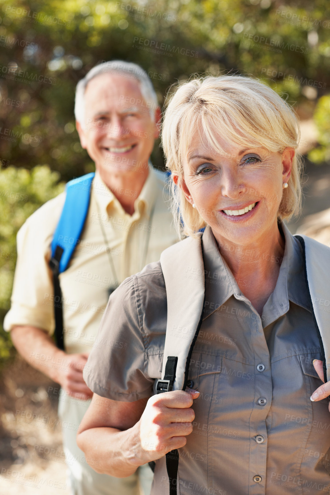 Buy stock photo Walking, hiking and portrait with old couple in nature for trekking, fitness and adventure. Wellness, retirement vacation and backpacking with senior man and woman in forest for travel and trip
