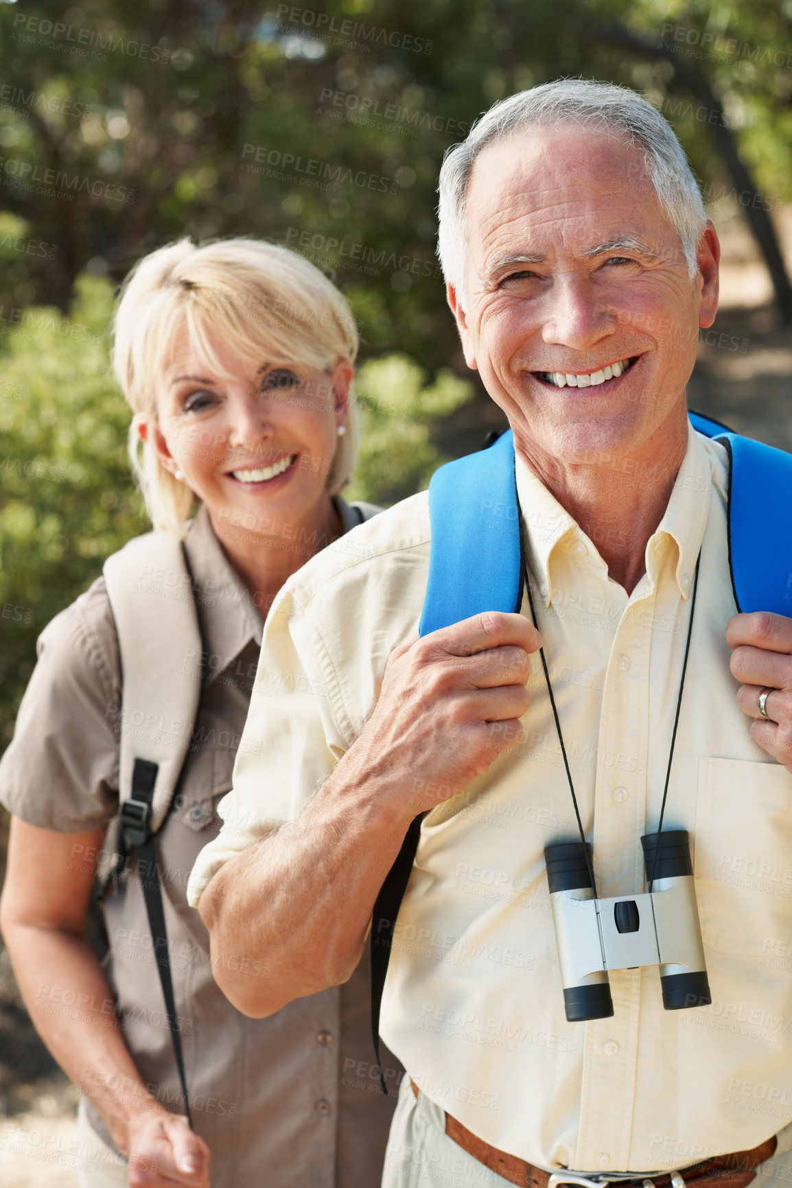 Buy stock photo Senior, happy couple and man in forest with hiking, adventure travel or bonding with backpacking. Relationship, hobby and people with smile for retirement holiday, trekking portrait and healthy aging