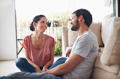 Buy stock photo Shot of a romantic young couple spending quality time together in their living room