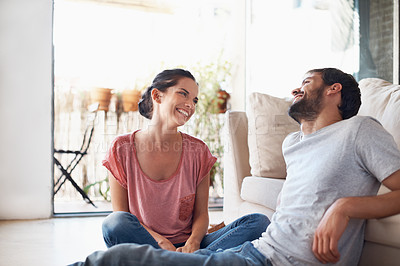 Buy stock photo Shot of a romantic young couple spending quality time together in their living room