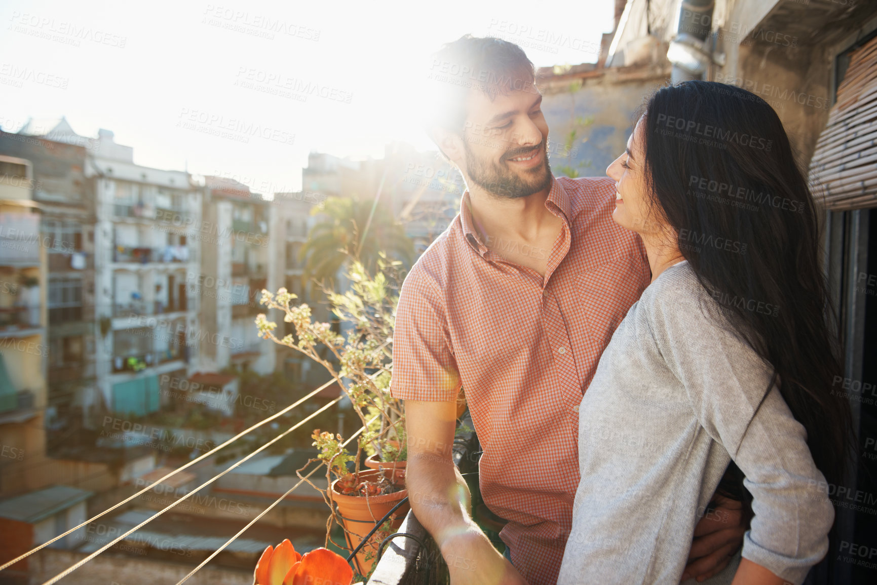 Buy stock photo Couple, balcony and smile with love on vacation for travel, holiday and relationship in hotel. Marriage, flare and people with bonding, relax and weekend with hug and support for anniversary trip