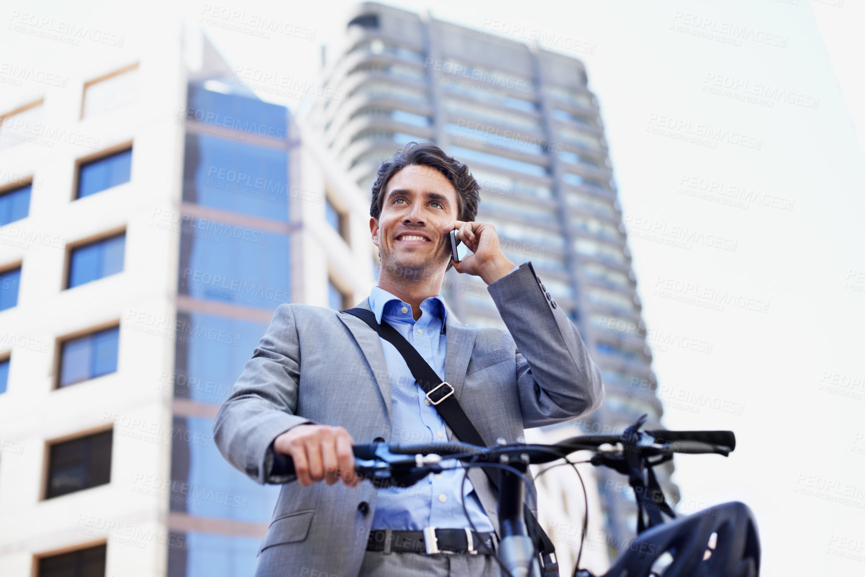 Buy stock photo Phone call, business and happy man on bicycle for travel, morning commute and talking for contact. Corporate, low angle and person with cellphone, conversation and bike for trip, journey and update