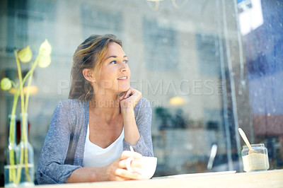 Buy stock photo A woman at a coffee shop looking out the window