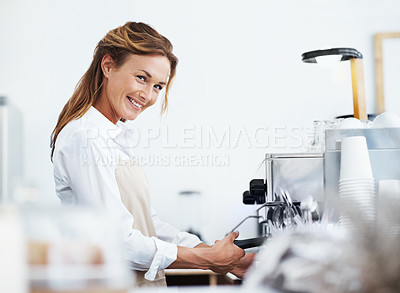 Buy stock photo Portrait of a pretty barista using the coffee machine with copyspace