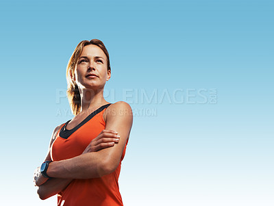 Buy stock photo Young woman looking into the distance wearing sports clothing
