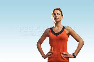 Buy stock photo Young woman wearing sports clothing standing with her hands on her hips