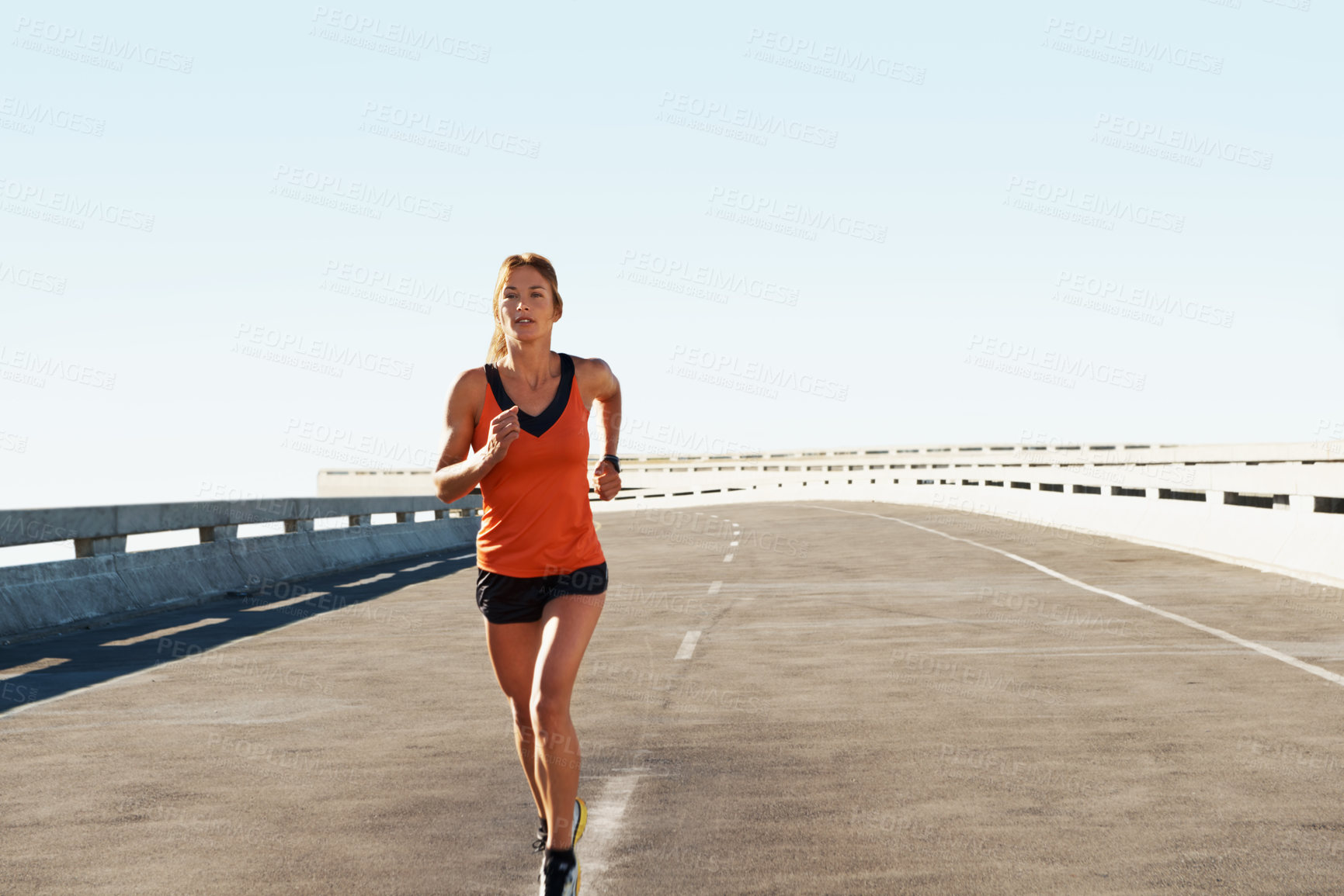 Buy stock photo Workout, woman and running for fitness in road with pace training, morning cardio and practice. Space, serious athlete and jog on highway bridge for exercise routine, endurance or health and wellness