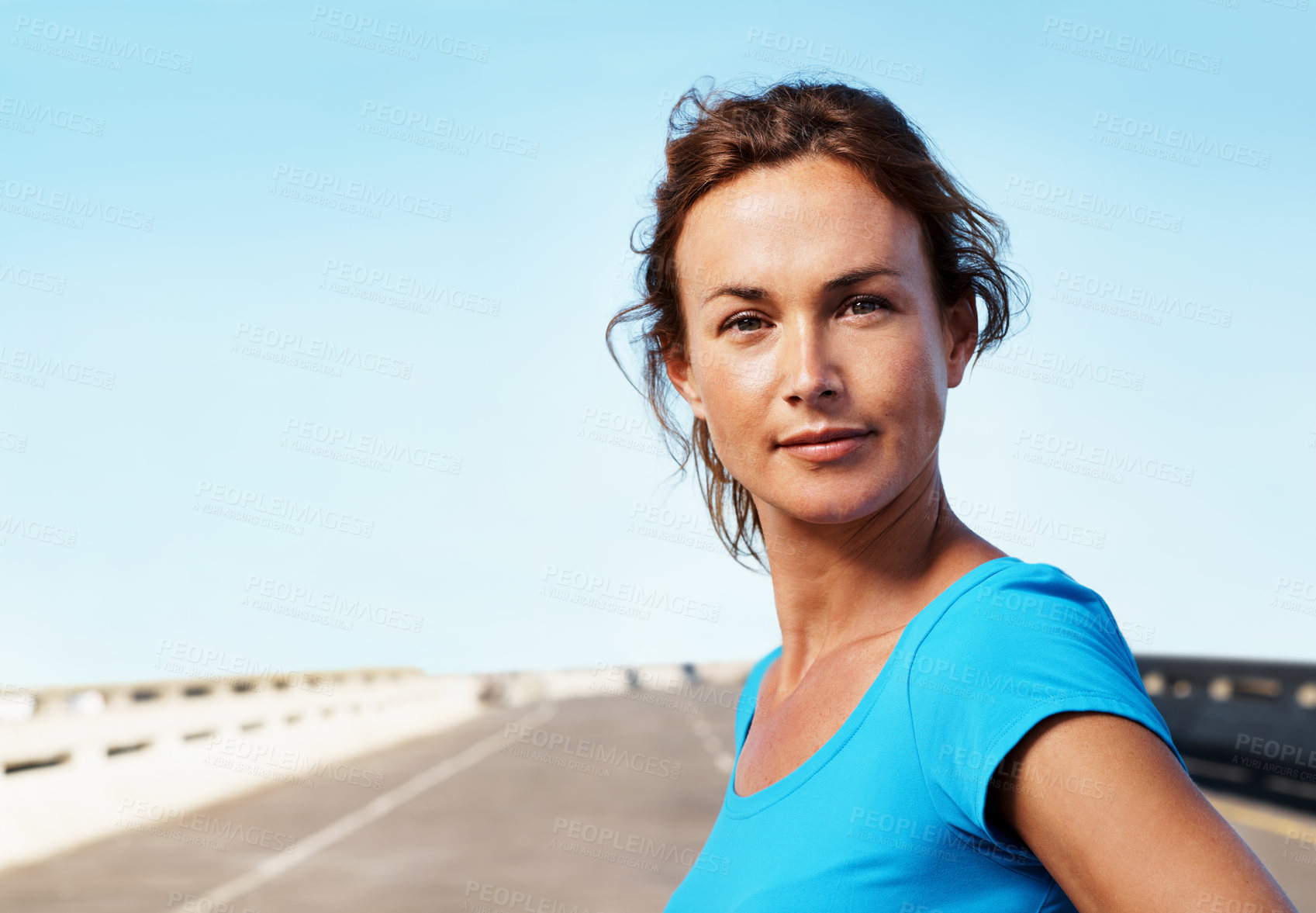 Buy stock photo Portrait, woman and outdoor in city with fitness, confident and getting ready for cardio exercise. Space, serious female person and runner on bridge with wellness, vitality and workout in street.