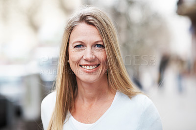 Buy stock photo A beautiful woman standing outside and smiling