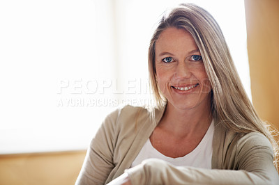 Buy stock photo A beautiful woman sitting in her home with copyspace
