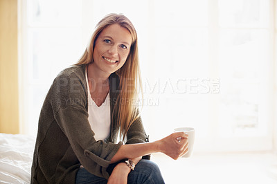 Buy stock photo A beautiful woman drinking coffee in her bedroom with copyspace