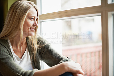 Buy stock photo A beautiful woman looking out the window with copyspace