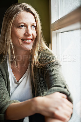 Buy stock photo A beautiful woman looking out the window