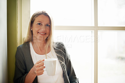 Buy stock photo A beautiful woman holding a cup of coffee with copyspace
