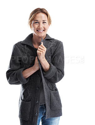 Buy stock photo An attractive woman holding onto her knitwear while smiling and isolated on white