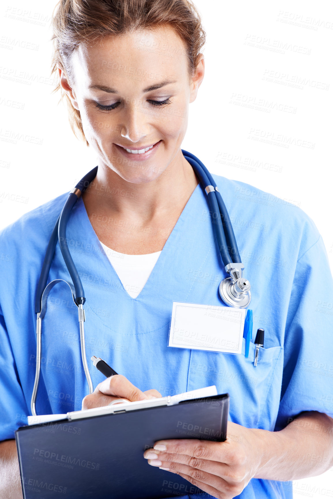 Buy stock photo An attractive female doctor writing on a clipboard while isolated on white